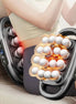 16-Head Fascia Gun being used on a person's leg